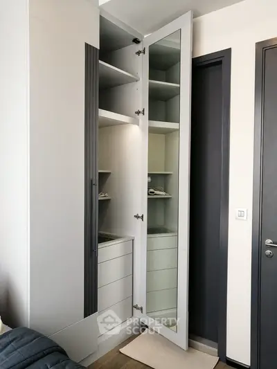 Modern wardrobe with mirror door in stylish bedroom interior