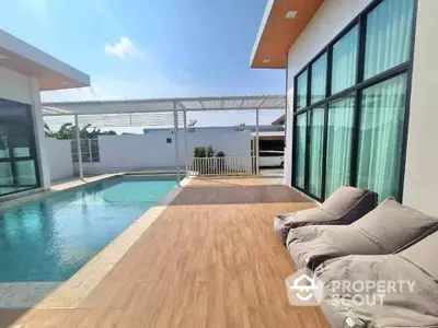 Luxurious modern villa with private pool and spacious deck area for ultimate relaxation.