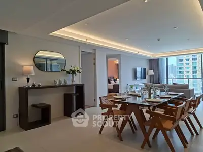 Luxurious open-plan living and dining area with modern decor and city view.