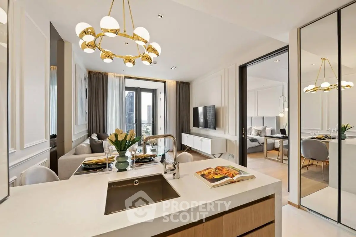 Luxurious open-plan living room and kitchen with elegant decor and city view.
