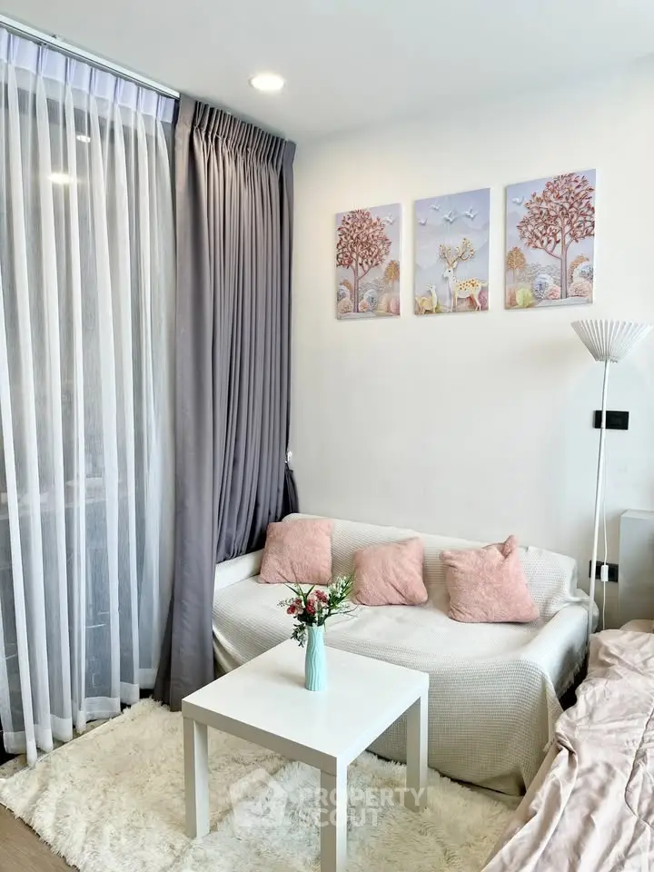 Charming living room with cozy decor and natural light, perfect for relaxation.