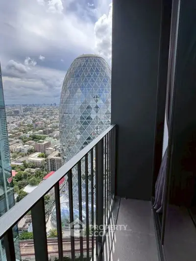 Stunning cityscape view from a modern high-rise balcony with iconic architecture.
