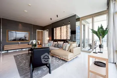 Luxurious modern living room with elegant decor and large windows offering stunning views.