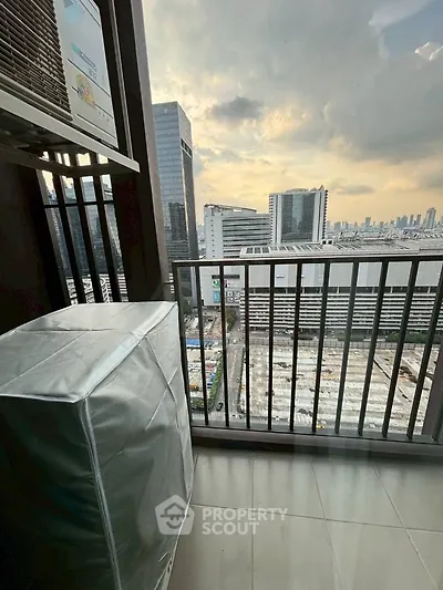 Stunning city view from high-rise balcony with modern urban skyline.