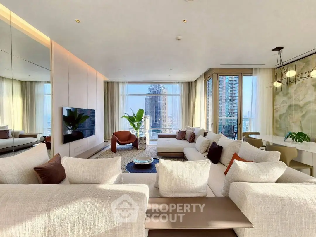 Luxurious modern living room with panoramic city views and elegant furnishings.