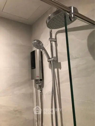 Modern bathroom with sleek shower fixtures and elegant tile design.