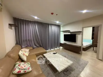 Spacious living room with modern decor and cozy seating area