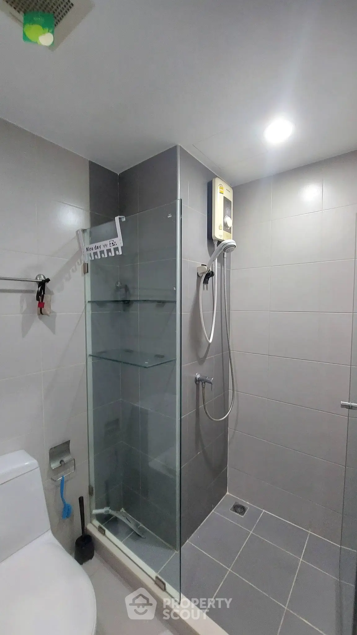 Modern bathroom with glass shower enclosure and sleek tile design