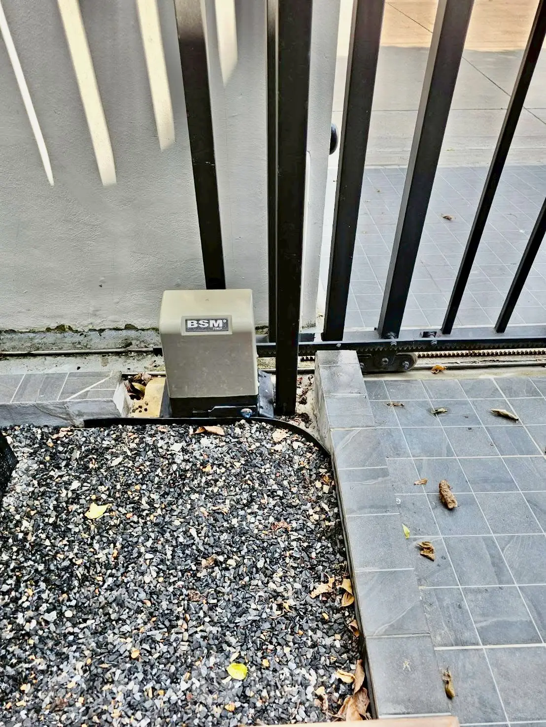 Modern gate with automatic opener in a stylish urban setting