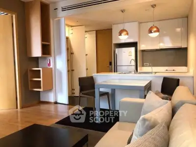 Modern open-layout living room with kitchen in a stylish apartment
