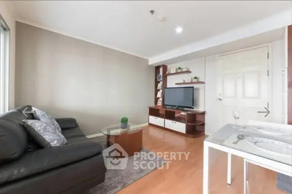 Modern living room with sleek furniture and stylish decor in a contemporary apartment.