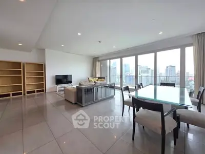 Spacious modern living room with city view and elegant dining area