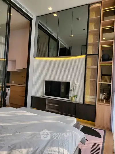 Modern bedroom with sleek design, featuring built-in storage and a cozy ambiance.
