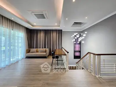 Spacious modern living room with elegant lighting and large windows