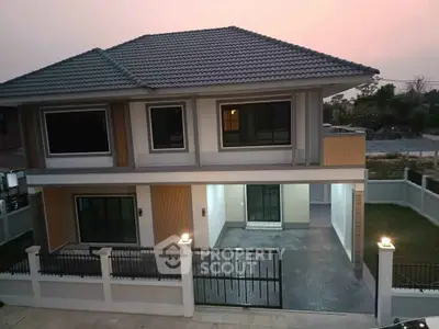Stunning two-story modern house with spacious driveway and elegant exterior design.