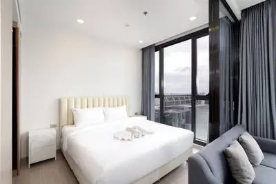 Luxurious bedroom with stunning city view and modern furnishings