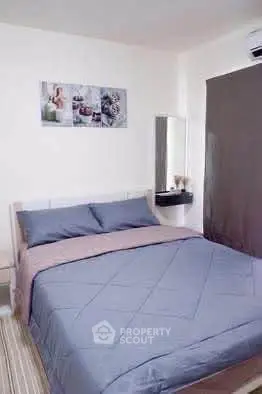 Cozy bedroom with stylish decor and comfortable bedding