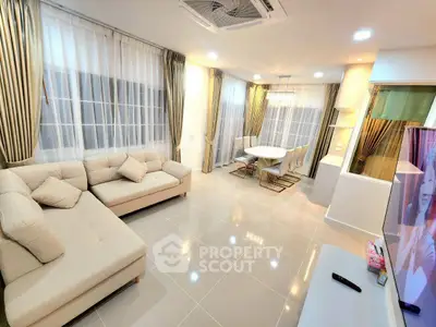 Spacious modern living room with elegant decor and large windows