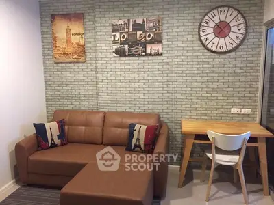 Chic living room with stylish decor and cozy seating in modern apartment.