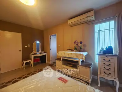 Cozy bedroom with elegant furniture and air conditioning in a modern apartment.