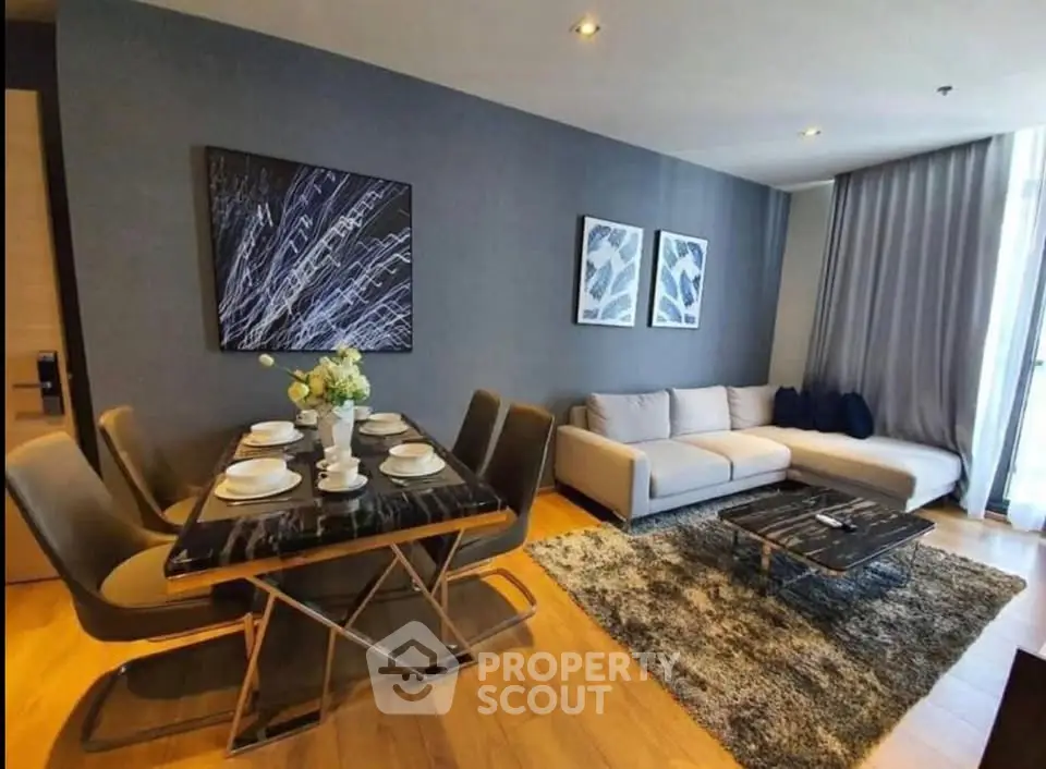 Modern living room with stylish decor and dining area in luxury apartment
