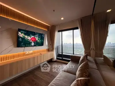 Luxurious living room with modern decor and stunning city view from balcony.