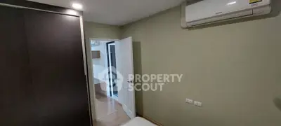 Cozy bedroom with air conditioning and modern wardrobe, ideal for comfortable living.