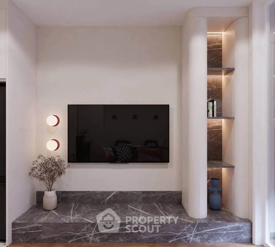 Modern living room with sleek TV setup and elegant marble accents