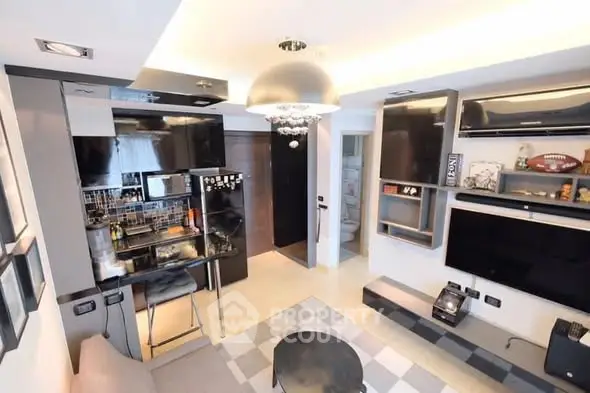 Modern living room with sleek design, open kitchen layout, and stylish decor, perfect for urban living.