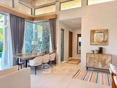 Luxurious open-plan living room with elegant dining area and modern decor