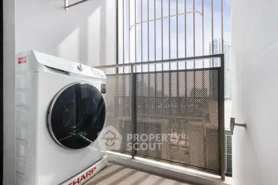 Modern balcony with washing machine and city view