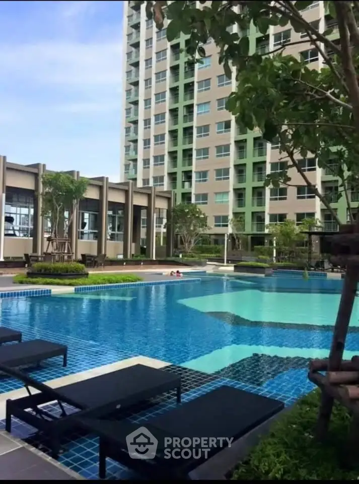 Luxurious condominium with stunning pool and modern amenities for ultimate relaxation.
