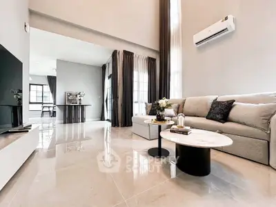 Spacious modern living room with elegant decor and natural light