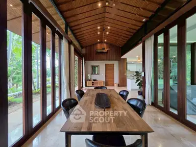 Stunning open-plan living room with wooden accents and garden view