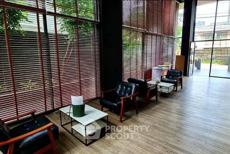 Spacious modern lobby with stylish seating and large windows offering natural light.