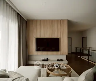Modern living room with sleek wooden paneling and large TV, perfect for relaxation.