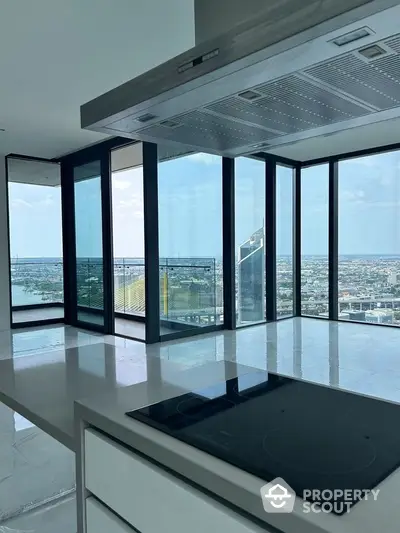 Luxurious modern kitchen with panoramic city view and sleek design