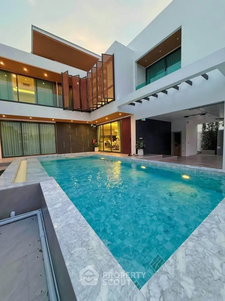 Luxurious modern home with stunning pool and elegant architecture
