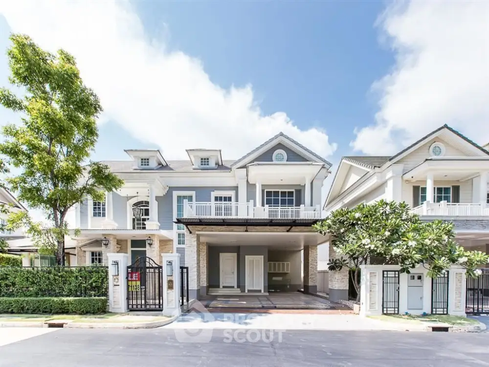 Charming suburban house with spacious driveway and lush greenery, perfect for family living.
