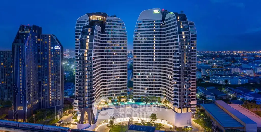 Stunning night view of modern high-rise buildings with illuminated cityscape