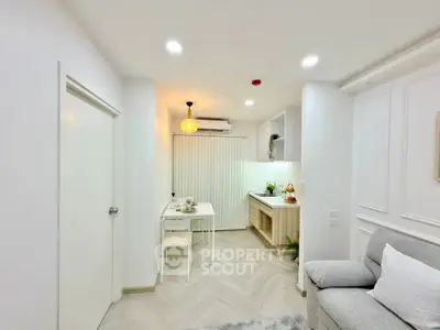 Modern compact living room with open kitchen and stylish decor