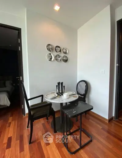 Chic dining nook with stylish decor and modern furniture in a cozy apartment.