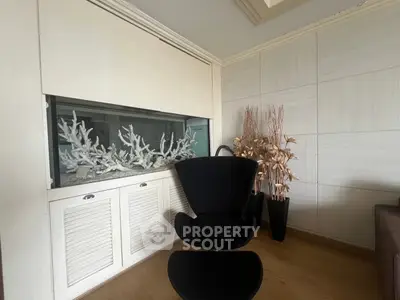 Stylish modern living room with unique aquarium feature and elegant decor