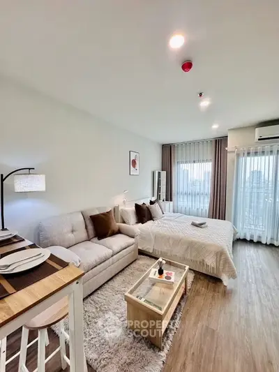 Modern studio apartment with cozy living area and stylish decor