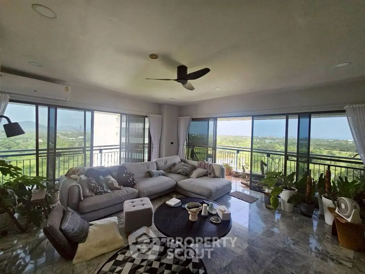 Spacious living room with panoramic views and modern decor