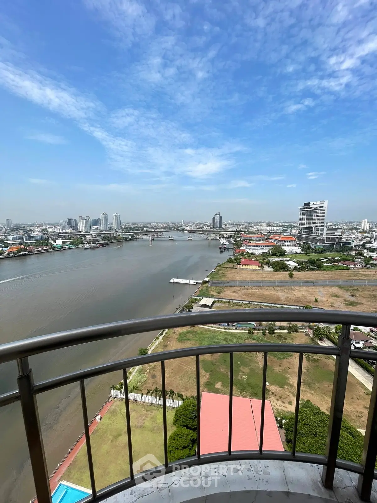 Stunning river view from high-rise balcony with city skyline