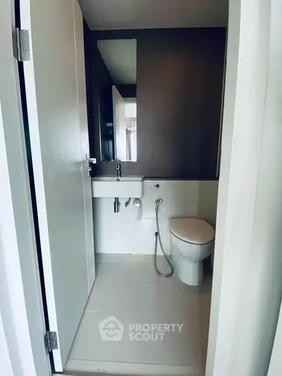 Modern bathroom with sleek design and contemporary fixtures in a stylish apartment.