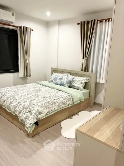 Cozy bedroom with modern decor and natural light