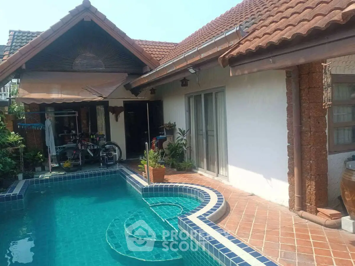 Charming villa with private pool and rustic tile roof, perfect for relaxation.