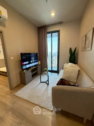 Cozy living room with modern decor and balcony view